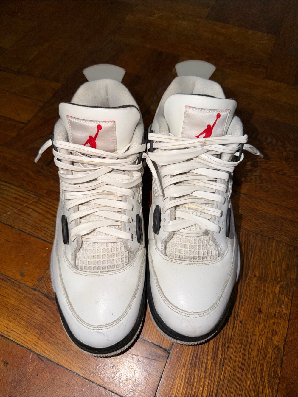 Nike Air Jordan 4 White with Red Jumpman and Black Accents